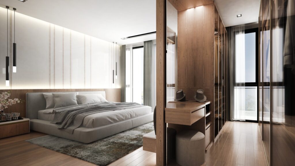open walk-in wardrobe with dark wood in a white bedroom